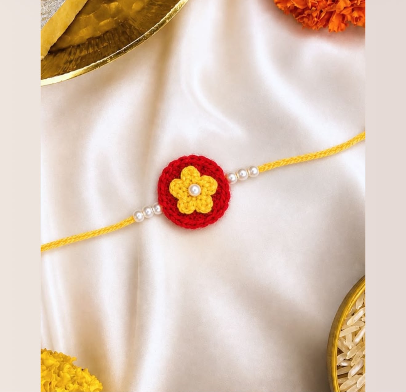 Product Name: Handmade Crochet Floral Rakhi – Red & Yellow Pearl